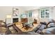 Spacious living room features a fireplace, hardwood floors, and plenty of natural light at 989 Pinfeather Ct, Lawrenceville, GA 30043