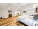 Bright main bedroom with hardwood floors, tray ceiling and ceiling fan for added comfort at 989 Pinfeather Ct, Lawrenceville, GA 30043