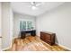 Bright office space with hardwood floors, large windows, and a ceiling fan with built in lighting at 989 Pinfeather Ct, Lawrenceville, GA 30043