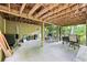 Open patio with natural surroundings is perfect for entertaining or enjoying the outdoors at 989 Pinfeather Ct, Lawrenceville, GA 30043