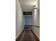 Carpeted staircase leading to a finished basement with wooden floors and a light grey wall paint at 989 Pinfeather Ct, Lawrenceville, GA 30043