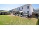 Backyard featuring a screened porch, hot tub, well maintained lawn, and tasteful landscaping for outdoor entertaining at 146 Citrine Way, Acworth, GA 30101