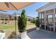 Backyard featuring a patio, screened-in porch, and manicured lawn, ideal for relaxing and entertaining guests at 146 Citrine Way, Acworth, GA 30101