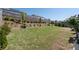 Expansive backyard featuring lush grass, mature trees, and a sturdy wooden fence for privacy and curb appeal at 146 Citrine Way, Acworth, GA 30101