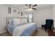 Bedroom with queen bed, ceiling fan, accent chair, and neutral colored walls and carpet at 146 Citrine Way, Acworth, GA 30101