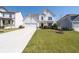 Inviting two-story home with a well-maintained lawn, a colorful flowerbed, and a paved driveway at 146 Citrine Way, Acworth, GA 30101