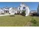 Attractive two-story home with a lush green lawn, colorful landscaping, and a long driveway at 146 Citrine Way, Acworth, GA 30101