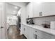 Sleek kitchen featuring white cabinets, subway tile backsplash, and stainless steel appliances at 146 Citrine Way, Acworth, GA 30101