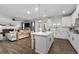 Bright kitchen boasts white cabinets, a center island with seating, and stainless appliances at 146 Citrine Way, Acworth, GA 30101