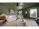 Living room featuring green walls and ceiling, natural light, and a cozy seating area at 146 Citrine Way, Acworth, GA 30101