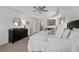 Bright bedroom features a large dresser, white bedding, and artwork, creating a serene and inviting atmosphere at 146 Citrine Way, Acworth, GA 30101