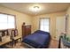 Comfortable bedroom with carpet, featuring a full-sized bed and a dresser, creating a relaxing retreat at 3257 Greenvale Way, Decatur, GA 30034