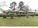 Inviting one-story brick home with green shutters, complemented by a well-maintained lawn and manicured landscaping at 3257 Greenvale Way, Decatur, GA 30034