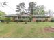 Traditional brick home with a covered porch and lush front yard, providing a classic and welcoming exterior at 3257 Greenvale Way, Decatur, GA 30034