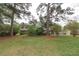 Spacious front yard of a brick home with mature trees, providing shade and curb appeal at 3257 Greenvale Way, Decatur, GA 30034