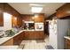 Functional kitchen with tile flooring, equipped with essential appliances and ample counter space at 3257 Greenvale Way, Decatur, GA 30034