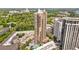 Stunning aerial view of a modern high-rise building with balconies, surrounded by lush greenery and a pool at 3481 Lakeside Dr # 601, Atlanta, GA 30326