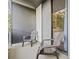 A cozy balcony with two chairs offers a relaxing outdoor space and view into the bedroom at 3481 Lakeside Dr # 601, Atlanta, GA 30326