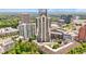 Stunning aerial view of a modern high-rise apartment complex surrounded by trees and city skyline at 3481 Lakeside Dr # 601, Atlanta, GA 30326