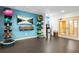 A fully-equipped fitness room with medicine balls, weights, yoga mats, and a TV for workout entertainment at 3481 Lakeside Dr # 601, Atlanta, GA 30326