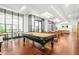 A classic pool table takes center stage in the bright and airy game room with seating at 3481 Lakeside Dr # 601, Atlanta, GA 30326