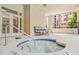 Relaxing hot tub with surrounding lounge chairs and city views from the outdoor patio at 3481 Lakeside Dr # 601, Atlanta, GA 30326