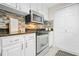 Modern kitchen with stainless steel appliances, granite countertops, and a stylish backsplash at 3481 Lakeside Dr # 601, Atlanta, GA 30326