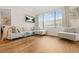 Inviting living room with a comfortable sofa, a large window, and stylish decor at 3481 Lakeside Dr # 601, Atlanta, GA 30326