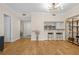 Open-concept living space with wood-look flooring, modern lighting, and a breakfast bar at 3481 Lakeside Dr # 601, Atlanta, GA 30326