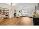 Open-concept living room with modern lighting, neutral decor, and sleek flooring at 3481 Lakeside Dr # 601, Atlanta, GA 30326
