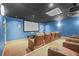 A private movie theater room with tiered seating and a large screen for comfortable viewing at 3481 Lakeside Dr # 601, Atlanta, GA 30326