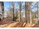 Backyard area showing the slope to the building at 384 Teal Ct, Roswell, GA 30076
