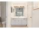 Bright bathroom with a white vanity, modern fixtures, and a view into the bedroom at 384 Teal Ct, Roswell, GA 30076