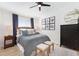 Comfortable bedroom with stylish furnishings, including a wicker headboard and modern black dresser at 384 Teal Ct, Roswell, GA 30076