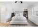Bedroom with a cozy bed, natural light, and a bookshelf filled with decorations and stuffed animals at 384 Teal Ct, Roswell, GA 30076