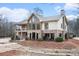 Beautiful clubhouse featuring stone accents, large windows, and outdoor living spaces at 384 Teal Ct, Roswell, GA 30076
