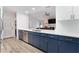 Contemporary kitchen featuring stainless appliances, white countertops and two-tone cabinets at 384 Teal Ct, Roswell, GA 30076