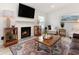 Inviting living room featuring a fireplace, large TV, and comfortable seating at 384 Teal Ct, Roswell, GA 30076