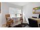 Bright office area with natural light, a small table, wicker chairs, and a work space at 384 Teal Ct, Roswell, GA 30076