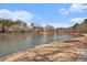 Serene pond view showcasing the community's natural beauty and walking trail at 384 Teal Ct, Roswell, GA 30076
