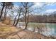 Picturesque river view with natural shoreline and mature trees at 384 Teal Ct, Roswell, GA 30076