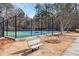Community tennis courts viewed from near a wooden bench at 384 Teal Ct, Roswell, GA 30076
