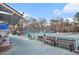 Well-maintained community tennis court with seating and shade nearby at 384 Teal Ct, Roswell, GA 30076
