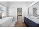 Bright bathroom with double vanity, soaking tub, and plenty of natural light at 3850 Laurel Nw Dr, Acworth, GA 30101