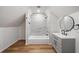 Cozy attic bathroom with a combined bathtub and shower, complemented by a sleek vanity at 3850 Laurel Nw Dr, Acworth, GA 30101