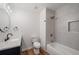Modern bathroom featuring tile shower over tub, sleek vanity, and wood-look flooring at 3850 Laurel Nw Dr, Acworth, GA 30101