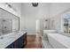 Luxurious bathroom with double vanity, marble countertops, soaking tub, and a separate shower at 3850 Laurel Nw Dr, Acworth, GA 30101