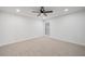 Spacious bedroom featuring a ceiling fan, neutral carpet, and bright window at 3850 Laurel Nw Dr, Acworth, GA 30101