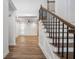 Inviting foyer with hardwood floors and a staircase with a dark metal railing at 3850 Laurel Nw Dr, Acworth, GA 30101