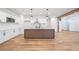 Modern kitchen featuring white cabinets, stainless steel appliances, and a unique island design at 3850 Laurel Nw Dr, Acworth, GA 30101